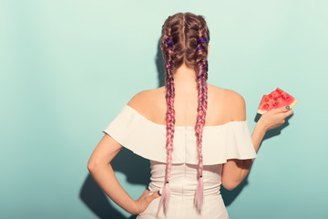 Stylish woman back hair. Cool hairstyle colorful braids. Summer portrait. - obrazy, fototapety, plakaty