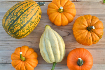 Pumpkins on wooden background