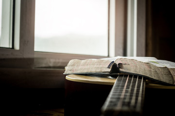 bible on acoustic guitar