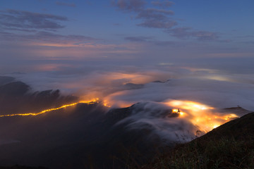 Clouds rolling over mountain on Lantau Island, viewed from the Lantau Peak (the 2nd highest peak in...