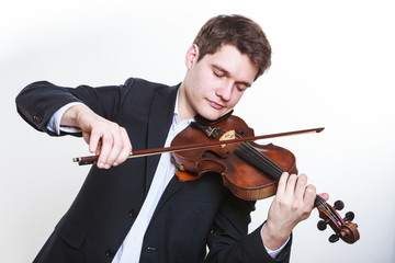 Man man dressed elegantly playing violin