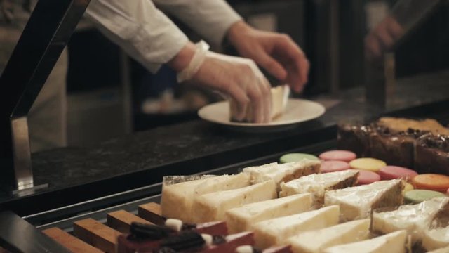 Bakery and confectionery products cake shop And desserts, hands with fresh bakery products near shop window