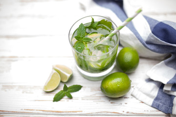 Mojito cocktail on white wood background