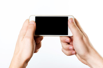 Man hand holding the white smartphone