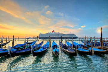 Group of gondolas moored by Saint Mark square