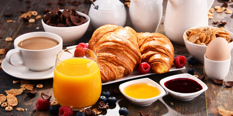 Breakfast served with coffee, juice, croissants and fruits