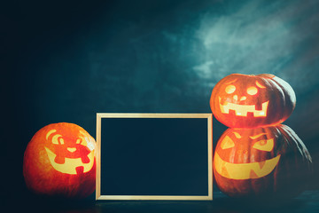 Three halloween Jack O' Lantern pumpkins