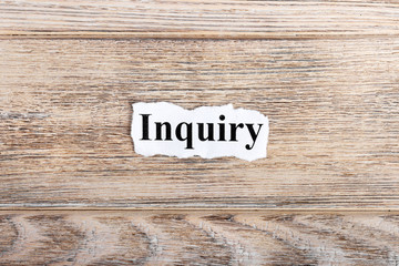 Inquiry text on paper. Word Inquiry on torn paper. Concept Image