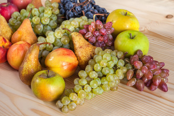 autumnal fruit still life on rustic wooden table background