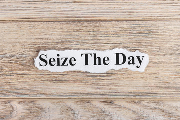 Seize The Day text on paper. Word Seize The Day on torn paper. Concept Image