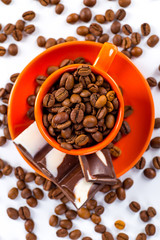 Coffee cup and beans on a white background.