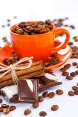 Coffee cup and beans on a white background.