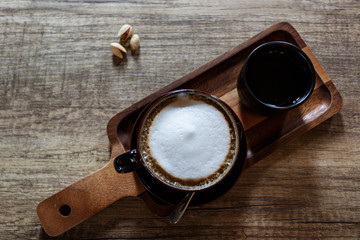 Fototapeta na wymiar Cup of hot coffee on table. Capuchino coffee