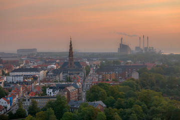 Fototapeta premium Copenhagen skyline at sunrise, smog over the city