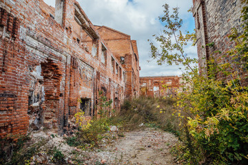 Ruined red brick industrial building. Abandoned and destroyed sugar factory in Novopokrovka, Tambov region