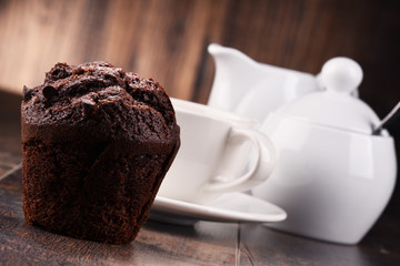 Composition with cup of coffee and muffin