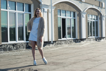 Fashionable girl on a city landscape