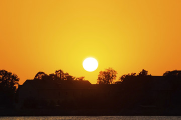 beautiful orange sunset of a large sun
