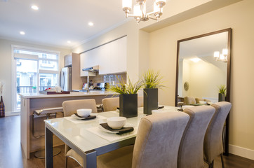 Modern bright dining room with kitchen in a luxury apartment. Interior design.