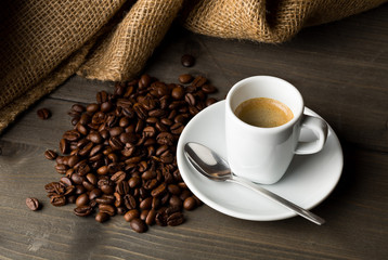 Coffee beans and cup of espresso