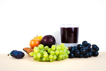 Grape juice with autumn seasonal fruits.