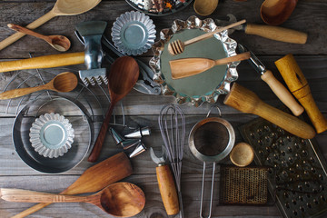 various kitchen utensils on rustic wooden table