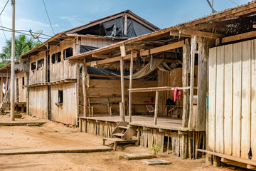 Wooden houses and dirt pathways of Amazon village