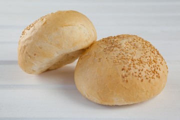 Two buns on wooden table