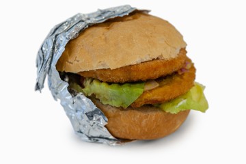 Close-up of hamburger wrapped in foil