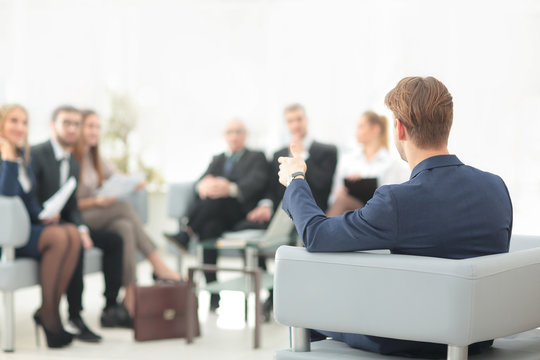 image is blurred.businessman conducting a meeting