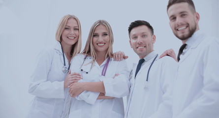 Team of medical professionals  looking at camera, smiling.