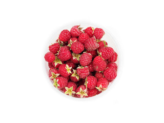 Berries of ripe red raspberries in a plastic transparent cup isolated on white background. Raspberry on the stems top view