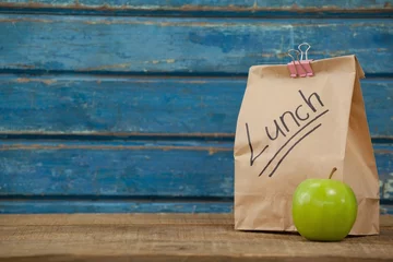 Fotobehang Apple and lunch bag © wavebreak3