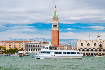 Yacht sailing on the Grand Canal in front of St Mark's Square in Venice