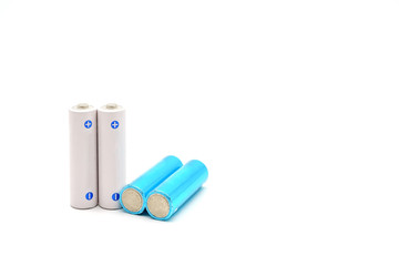A set of white AA batteries over white background, Close up with copy space and text.
