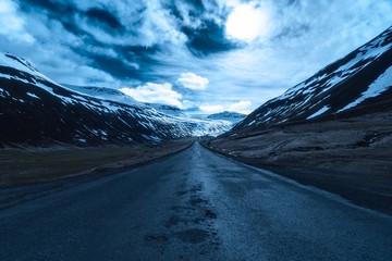 Moonlit road in Sudureyri, Westfjords, Iceland