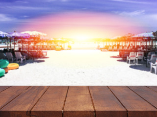 Empty top wooden table blurred sea of sunset background