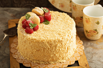 Napoleon layered cake with raspberry and macarons