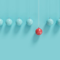 Red christmas ball Ornaments among blue ball hanging on white background. minimal christmas concept.