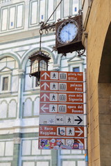 landmark sign near Basilica di Santa Maria del Fiore or Duomo in Florence , Italy