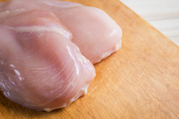The Raw chicken breast with dill ready to cooking