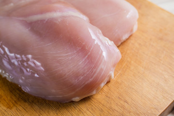The Raw chicken breast with dill ready to cooking