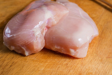 The Raw chicken breast with dill ready to cooking
