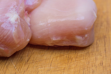 The Raw chicken breast with dill ready to cooking