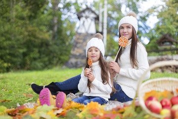 mother and daughter with lollipops