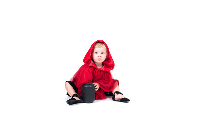 Little Red Riding Hood. Beautiful little girl in a red raincoat. Halloween