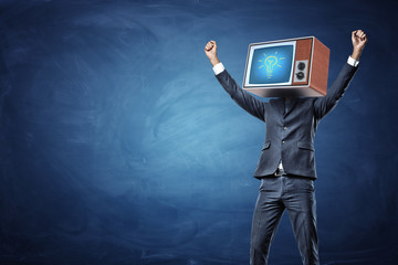 A victorious businessman with arms raised up and a retro TV showing a glowing bulb on his head.