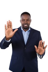 Smiling businessman touching the invisible screen