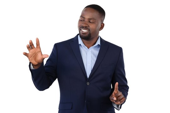 Businessman pressing an invisible virtual screen