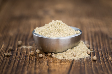 Portion of White Pepper on wooden background, selective focus